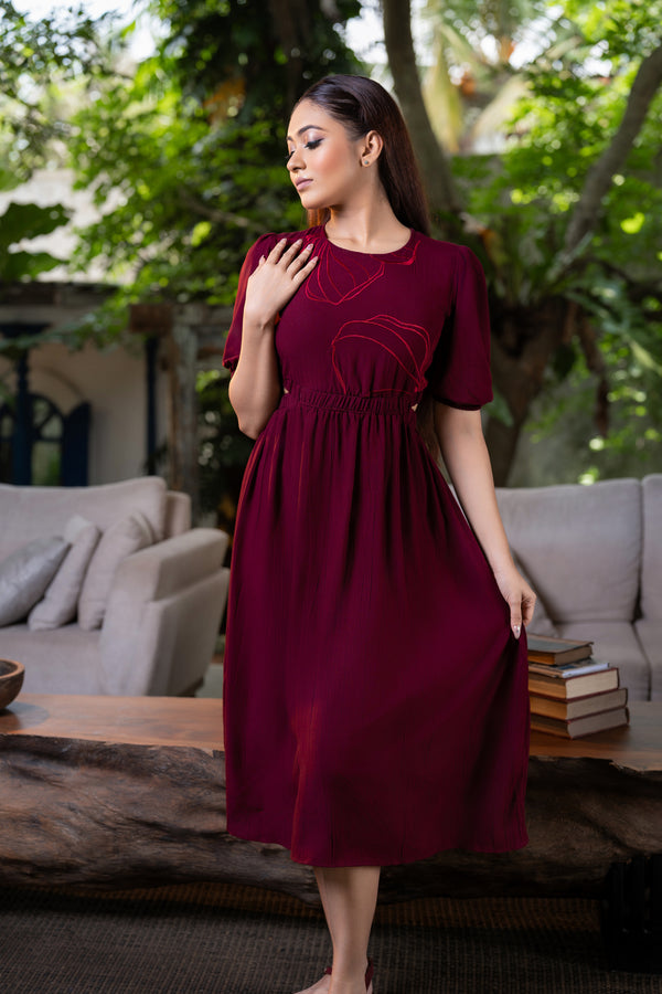 Women’s embroidered dress with back open detail, front view