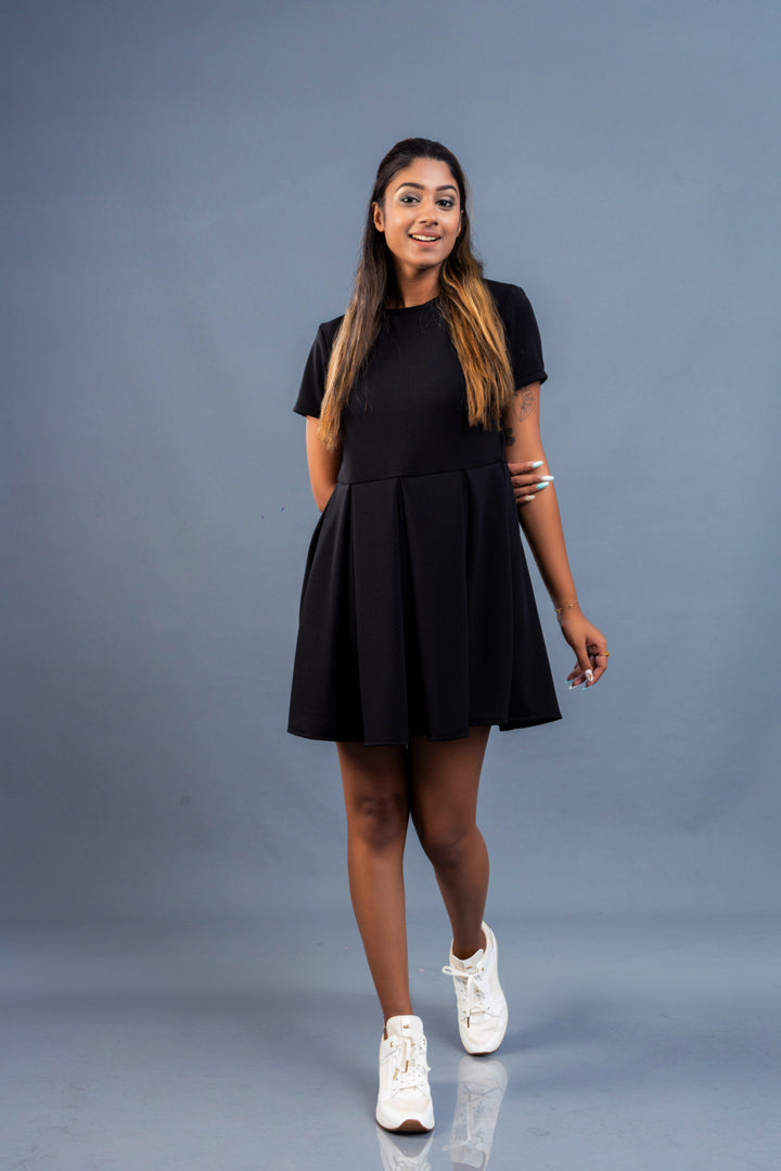 Women’s box pleat mini dress, front view