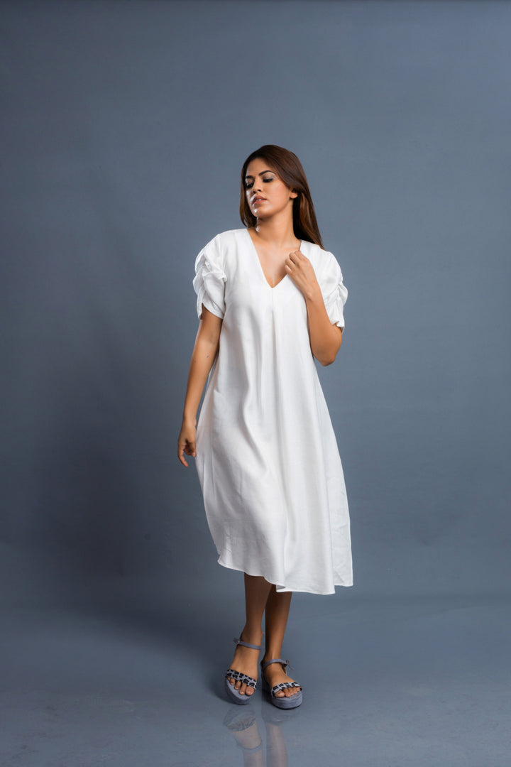 Women’s linen dress with gathered sleeve details, front view